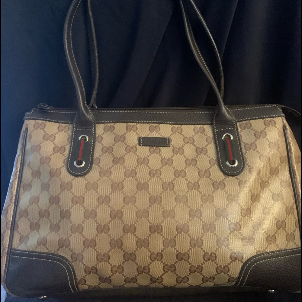 Authentic Gucci Crystal Bag with zipper closure.